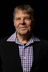 Portrait of James Pellow on black background