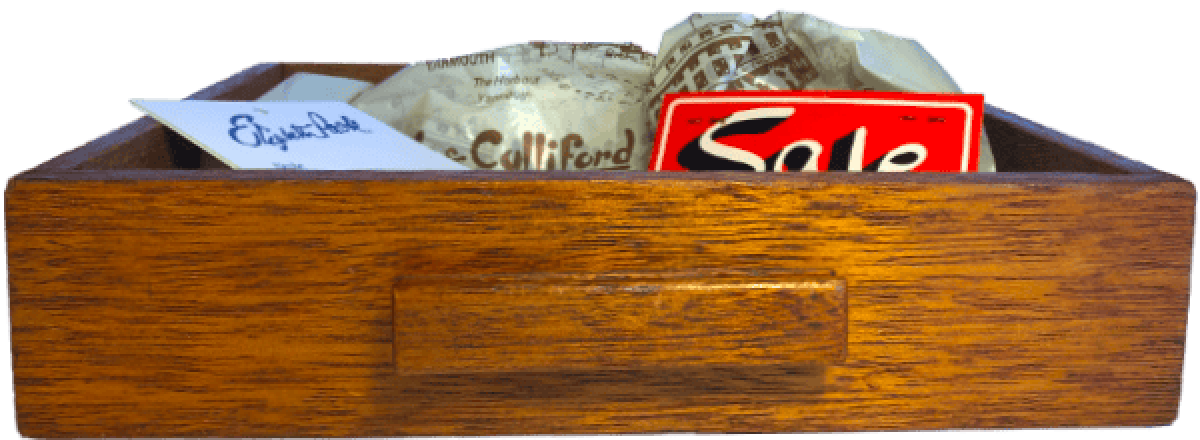 Drawer filled with carrier bags and sale tags